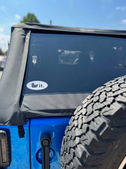 Duck it logo destination sticker 3x5 oval on blue jeep soft top