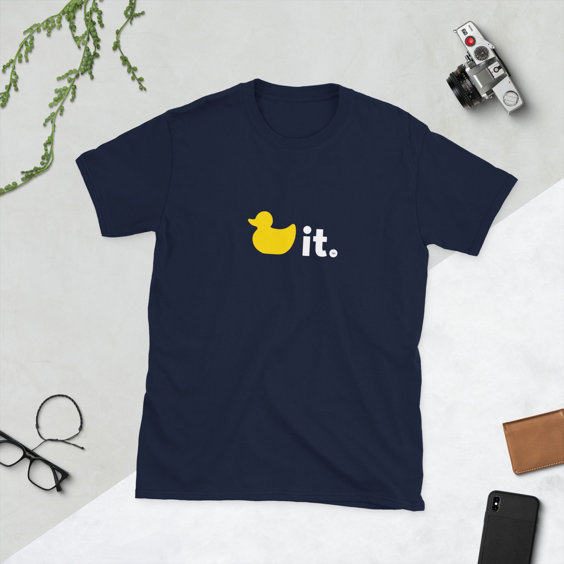 Duck it logo shirt navy blue on table